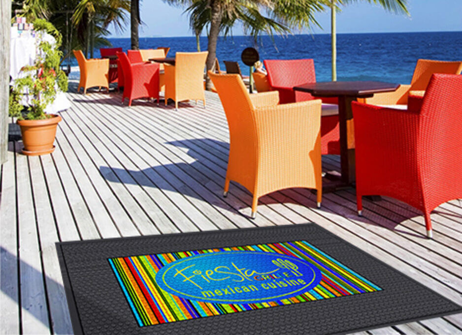 outdoor deck featuring a safety mat with colorful logo