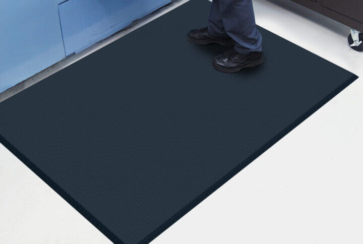 someone standing on an anti-fatique mat