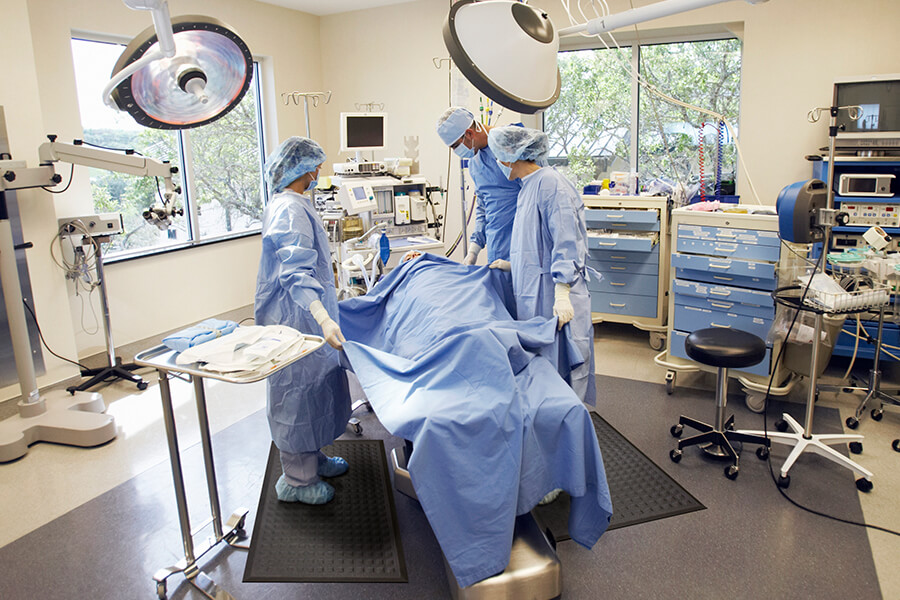 Surgeons preparing for surgery