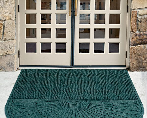 Waterhog Eco Grand Premier mat in front of a business's entryway