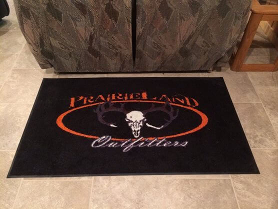 floor mat featuring prairieland outfitters logo